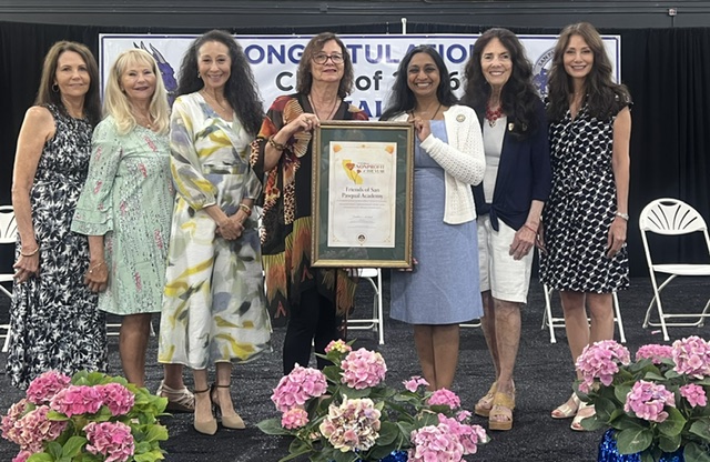 Board of Directors with Nonprofit of the Year Plaque